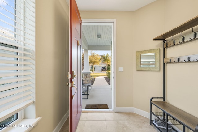 entryway with light tile patterned floors