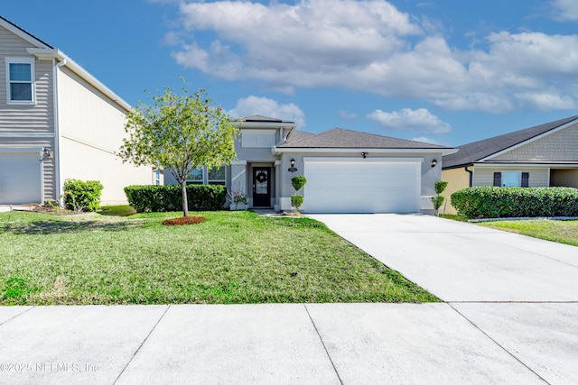 view of front of home with a front lawn and a garage