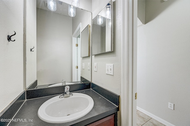 bathroom with vanity and tile patterned floors