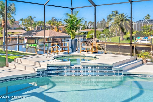 view of pool with a lanai and a jacuzzi