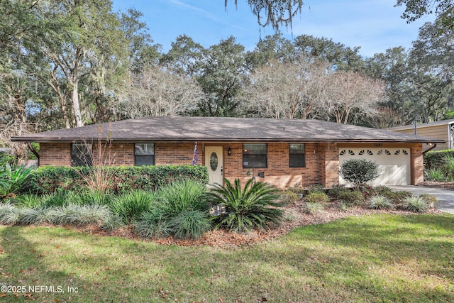 ranch-style house with a garage and a front yard