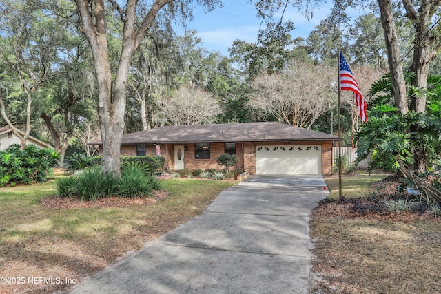 ranch-style home featuring a garage and a front lawn