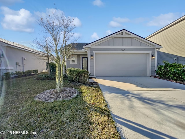 single story home with a front yard and a garage