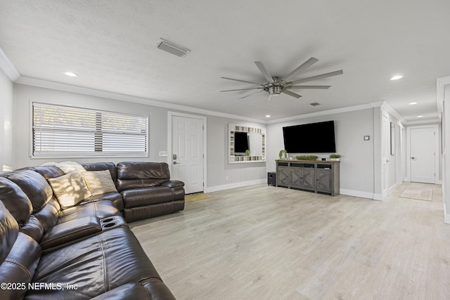 living room featuring ceiling fan, light wood-type flooring, and ornamental molding