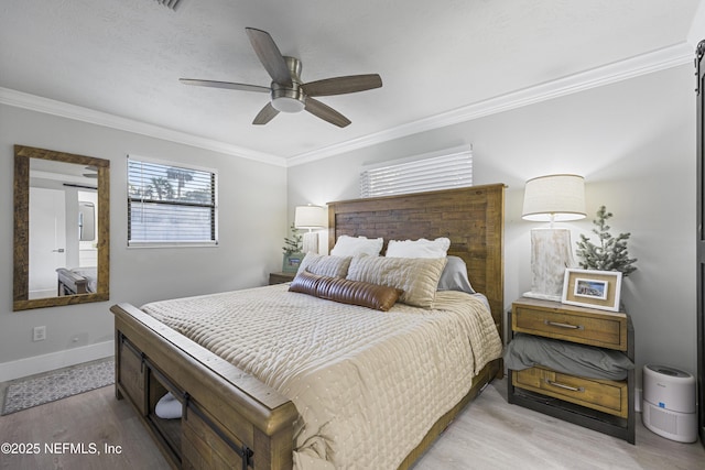 bedroom with ceiling fan, light wood-type flooring, and crown molding