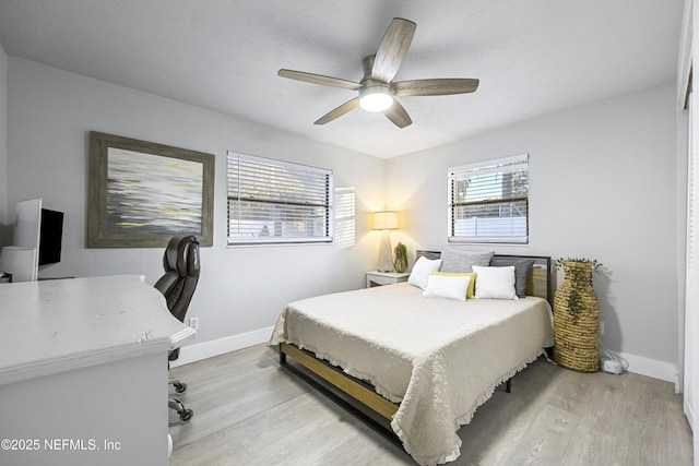 bedroom featuring ceiling fan and light hardwood / wood-style flooring