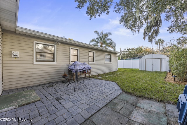 view of patio with a shed