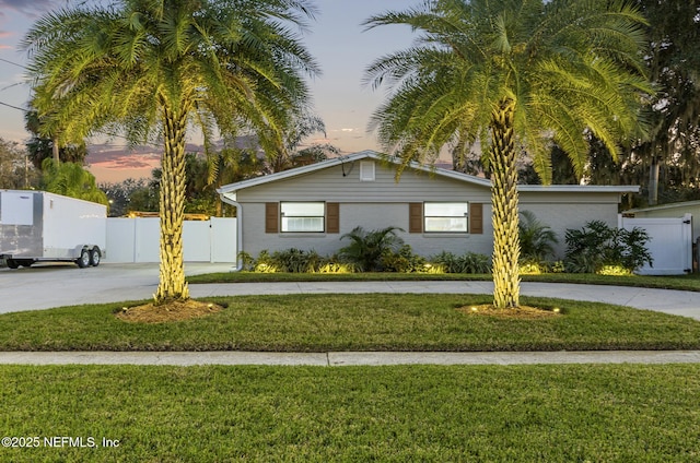 view of front of house with a yard