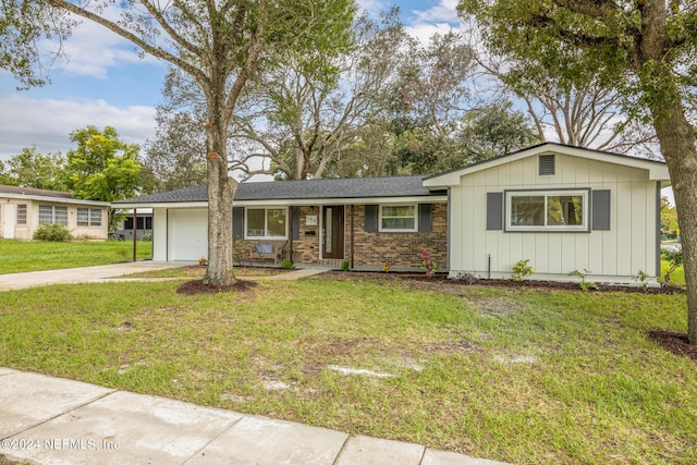 ranch-style home with a front lawn and a garage