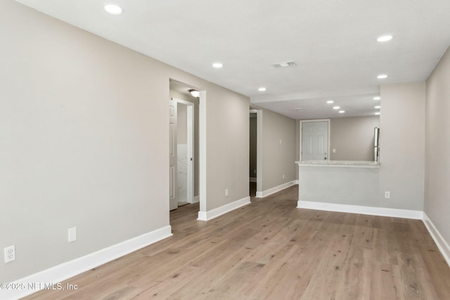 unfurnished living room with light wood-type flooring