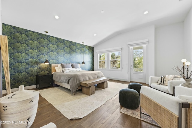 bedroom featuring hardwood / wood-style floors and access to outside