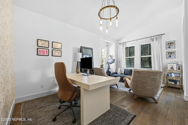 office area featuring vaulted ceiling, dark hardwood / wood-style floors, and a chandelier