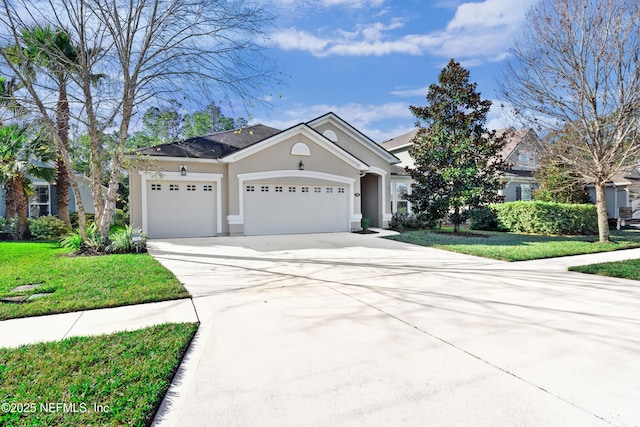 view of front of house featuring a front yard and a garage