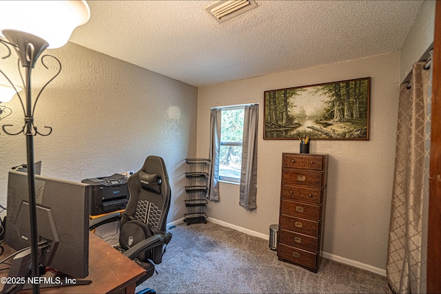 office with carpet and a textured ceiling