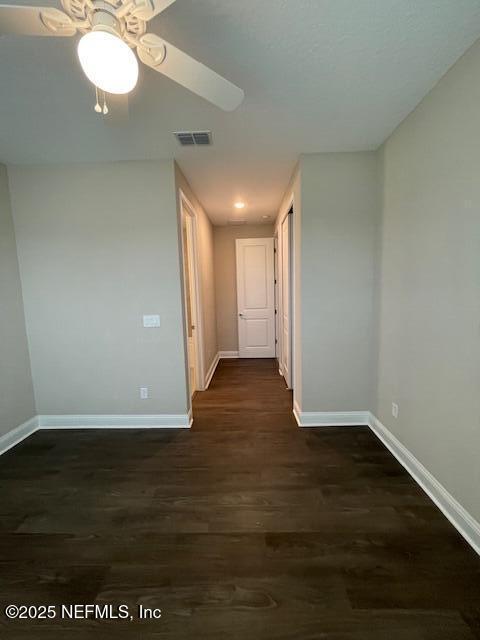 hallway featuring dark hardwood / wood-style floors