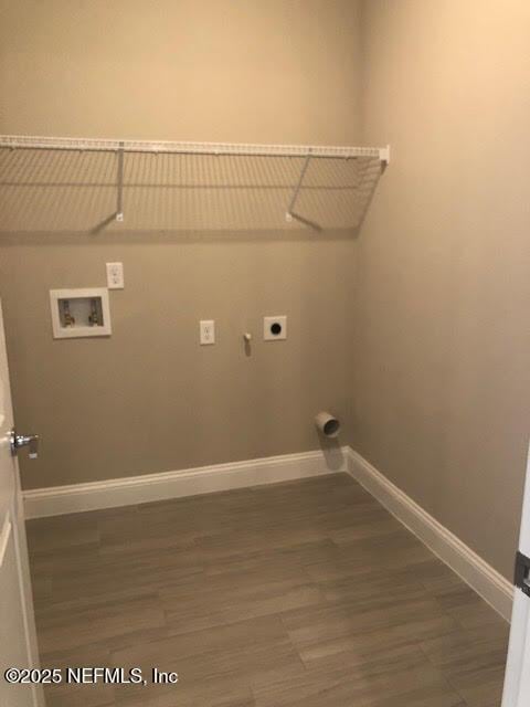 laundry room featuring washer hookup, dark hardwood / wood-style flooring, and electric dryer hookup