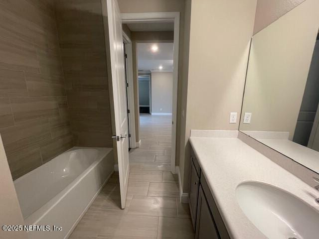 bathroom with tile patterned flooring and vanity