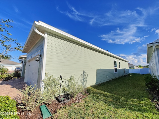 view of home's exterior with a lawn