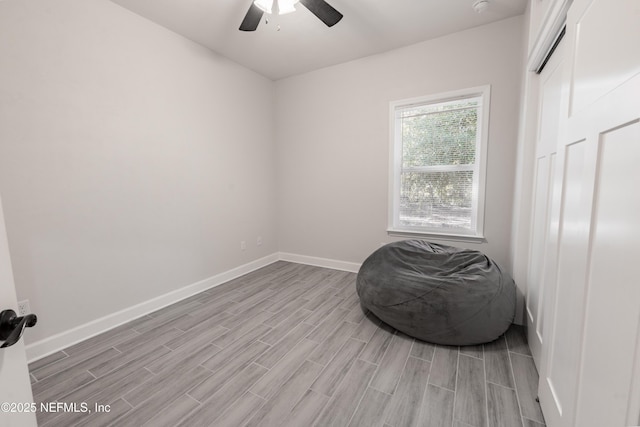 living area with ceiling fan