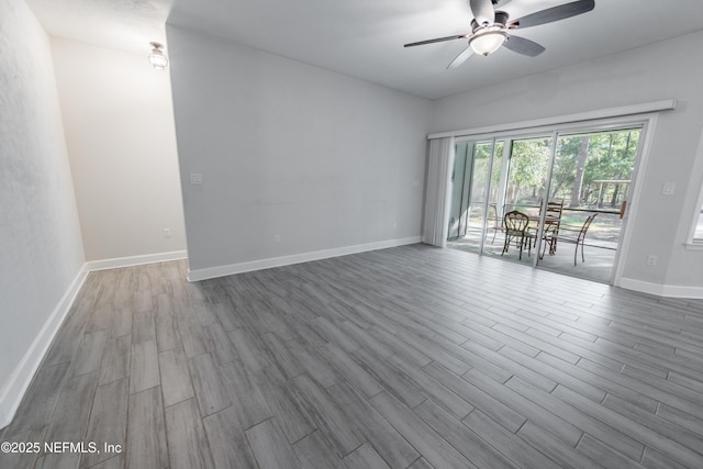 empty room featuring ceiling fan and wood-type flooring