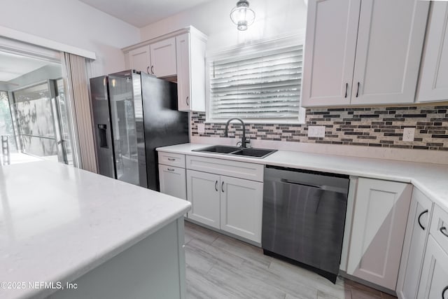 kitchen with fridge with ice dispenser, dishwasher, white cabinets, and sink