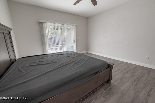 bedroom with ceiling fan and hardwood / wood-style floors