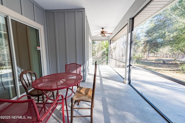 sunroom / solarium with ceiling fan