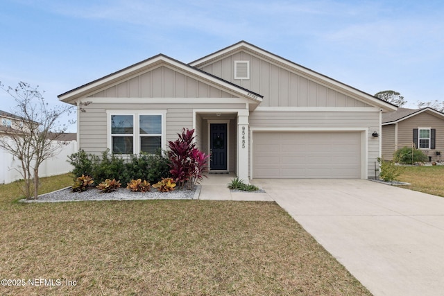 view of front of home with a garage and a front lawn