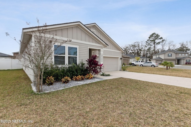 view of front facade featuring a garage and a front lawn