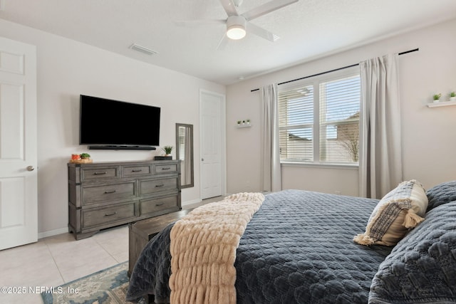 bedroom featuring ceiling fan and light tile patterned floors