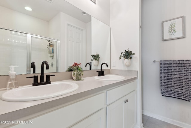 bathroom featuring tile patterned flooring, vanity, and an enclosed shower