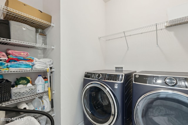 laundry room with washing machine and dryer