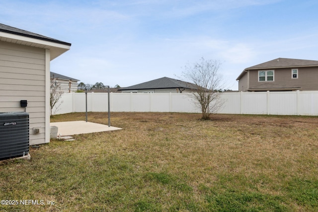 view of yard featuring cooling unit and a patio area