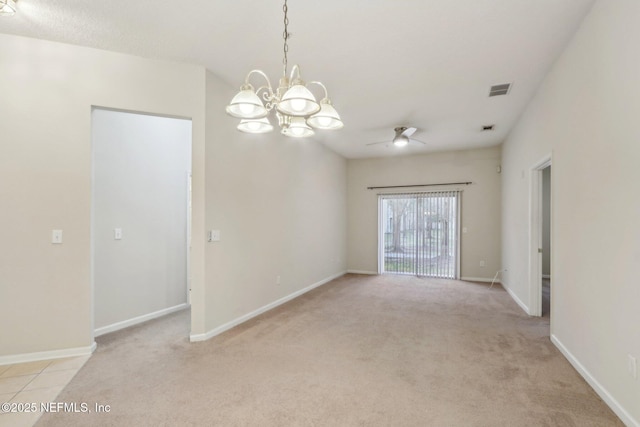 empty room with light carpet, ceiling fan with notable chandelier, visible vents, and baseboards