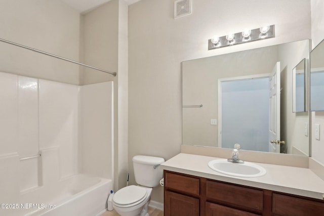 bathroom with toilet, visible vents, tub / shower combination, and vanity