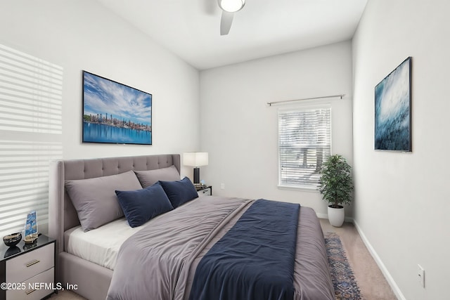 bedroom with ceiling fan, carpet flooring, and baseboards