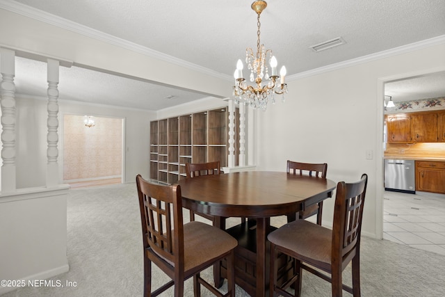 dining room featuring a textured ceiling, ornamental molding, light carpet, and a chandelier