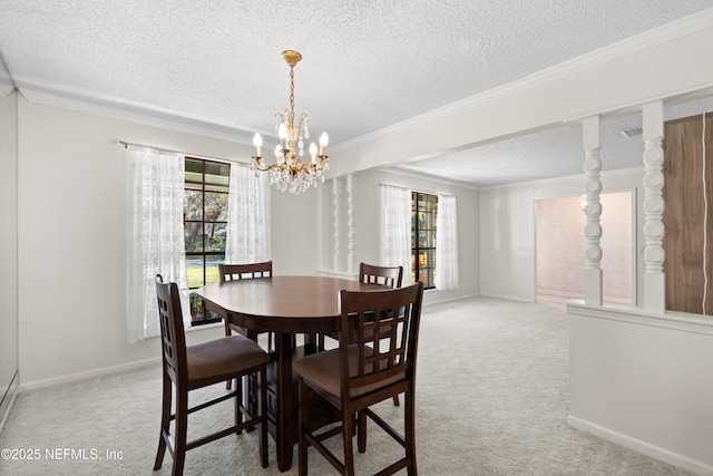 dining space featuring a textured ceiling, carpet floors, crown molding, and a chandelier