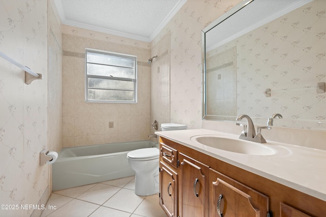 full bathroom featuring vanity, tiled shower / bath, toilet, ornamental molding, and a textured ceiling