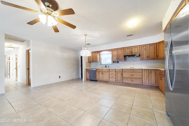 kitchen featuring decorative light fixtures, a textured ceiling, ceiling fan, light tile patterned floors, and appliances with stainless steel finishes