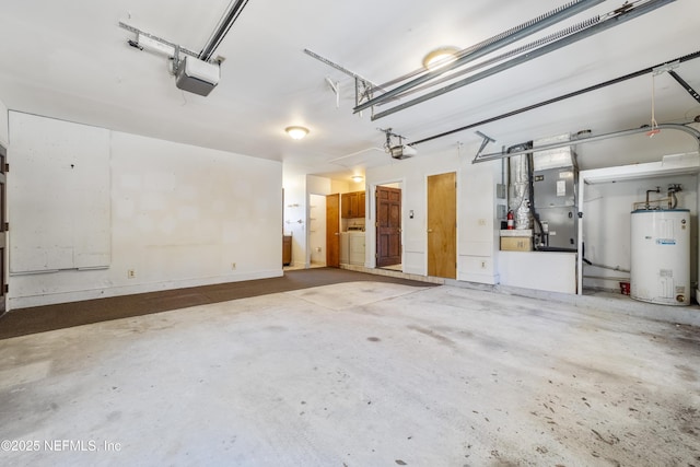 garage featuring washer / clothes dryer, water heater, and a garage door opener