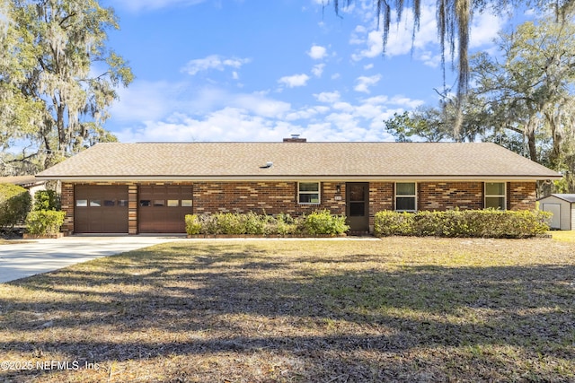 single story home with a front yard and a garage