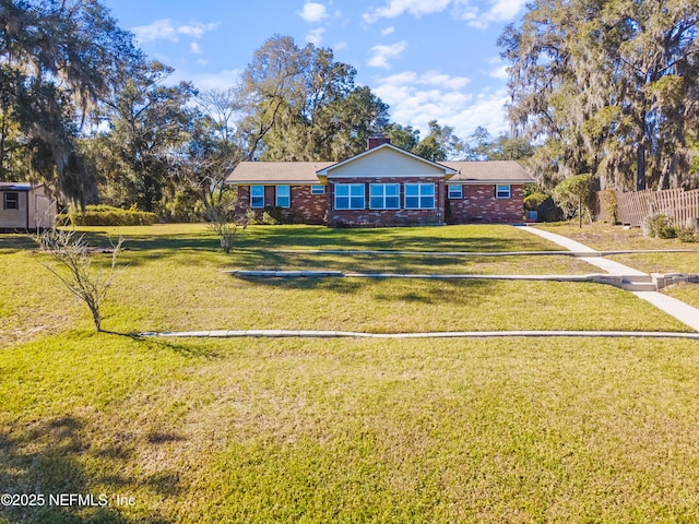 ranch-style home with a front lawn