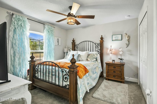 bedroom featuring carpet, ceiling fan, and a closet