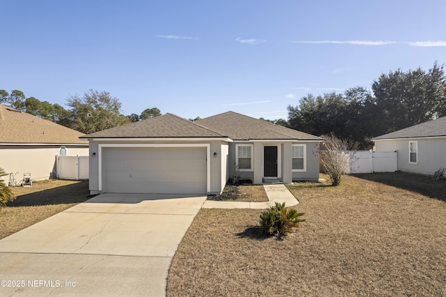 single story home featuring a garage and a front yard