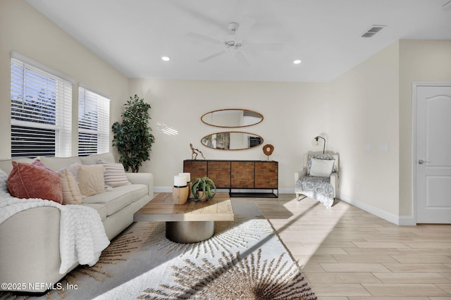 living room featuring ceiling fan and light wood-type flooring