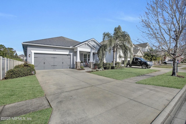 view of front of home featuring a garage and a front lawn