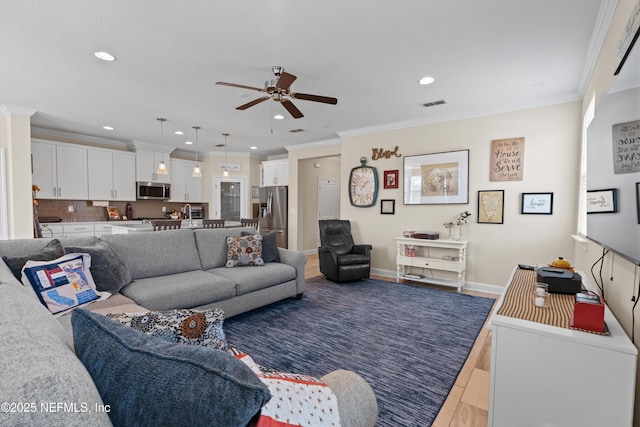 living room featuring ceiling fan, crown molding, and dark wood-type flooring