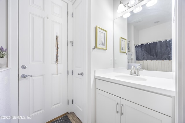 bathroom featuring vanity and a shower with curtain