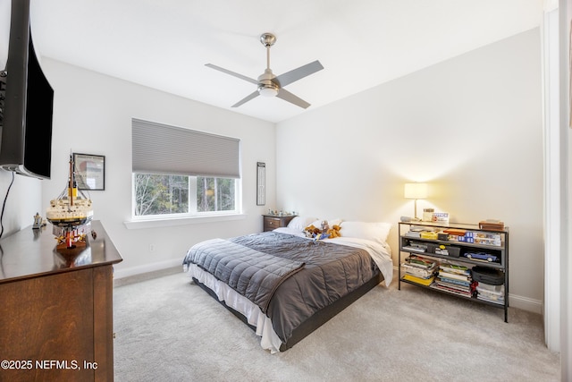 bedroom with ceiling fan and light colored carpet